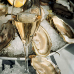 The luxe oyster experience | 12 oysters with signature toppings | a bottle of sparkling wine